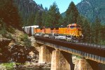 BNSF C44-9Ws 4469-4479-4447, leads a northbound autorack train over Indian Creek at Moccasin, California. July 28, 1999. 